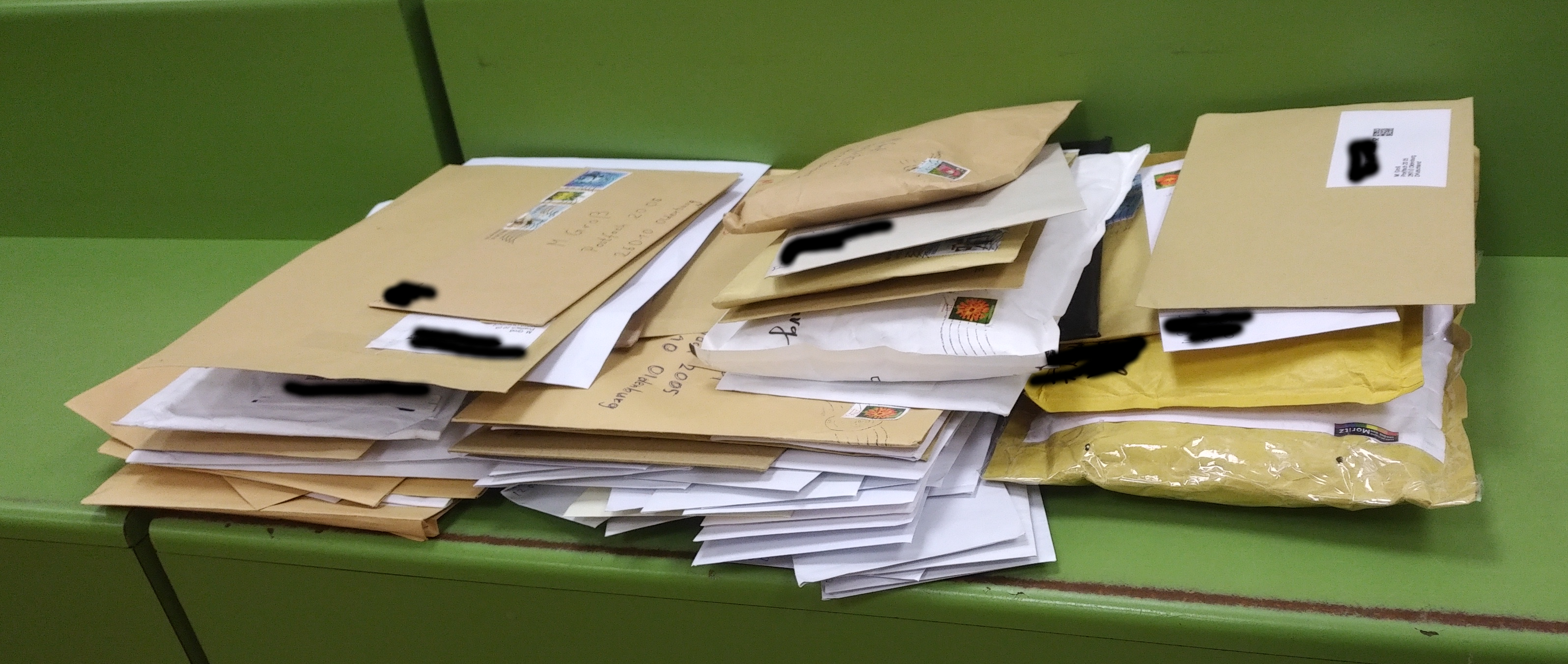 a large stack of envelopes